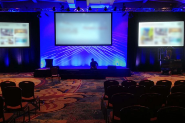 If your event is standard, the 16:9 screens may display visual content via PowerPoint that speakers prepare beforehand and present, often with just a single static conference graphic displayed between them when a transition is happening. Created by different people, the variety of presentations throughout the conference lack visual branding continuity and any sort of “wow” factor.
